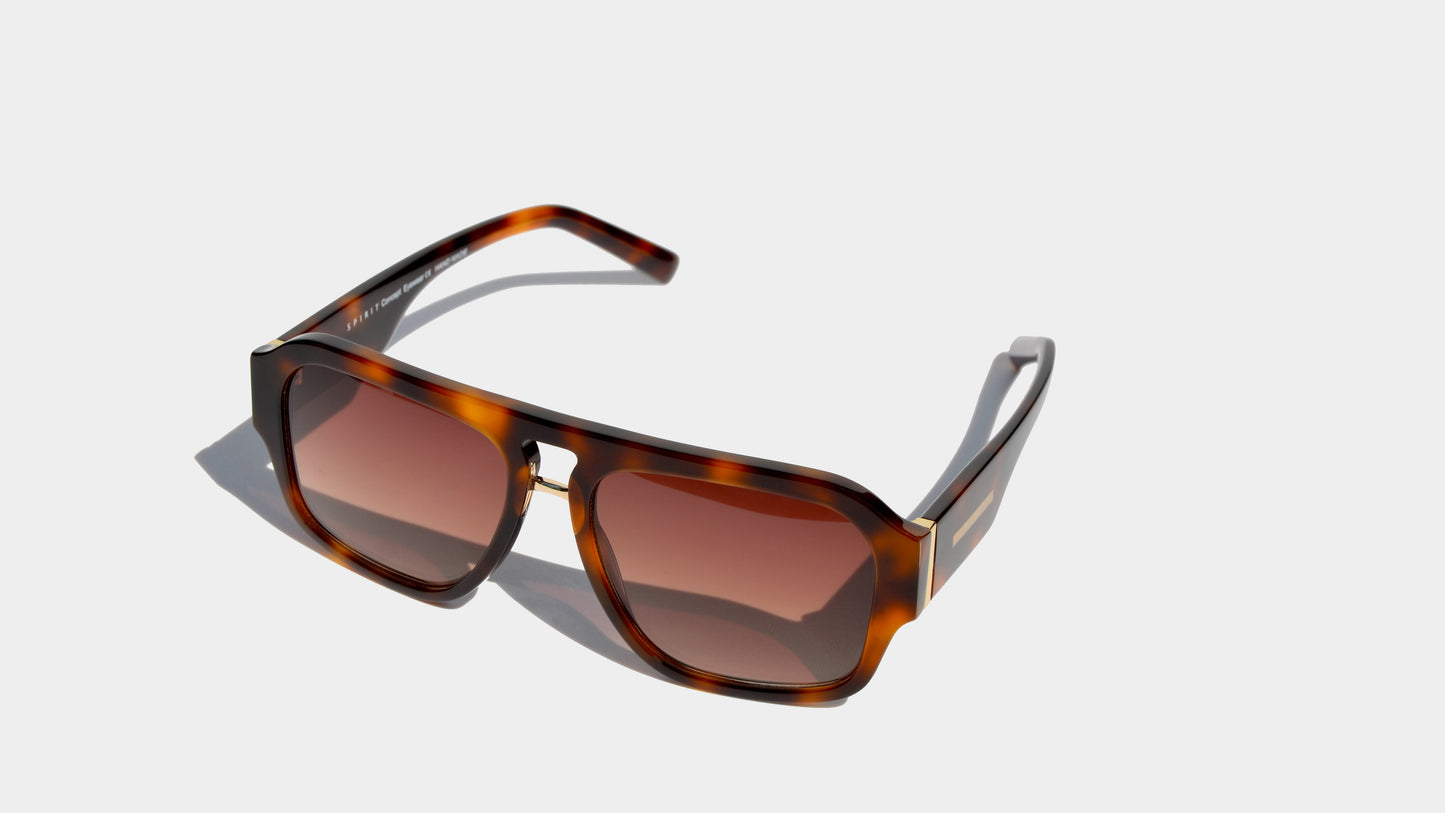 Angled front view of havana brown patten aviator style navigator frame sunglasses with amber square lenses