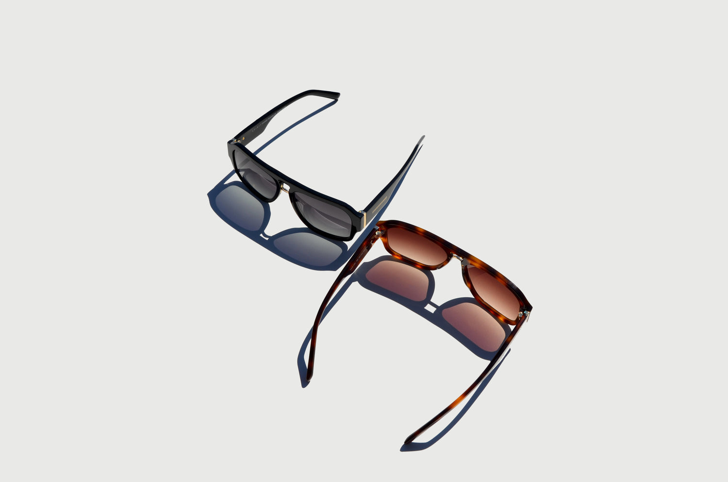 top view of mirrored two double bridge sunglasses black and brown arms extended straight 