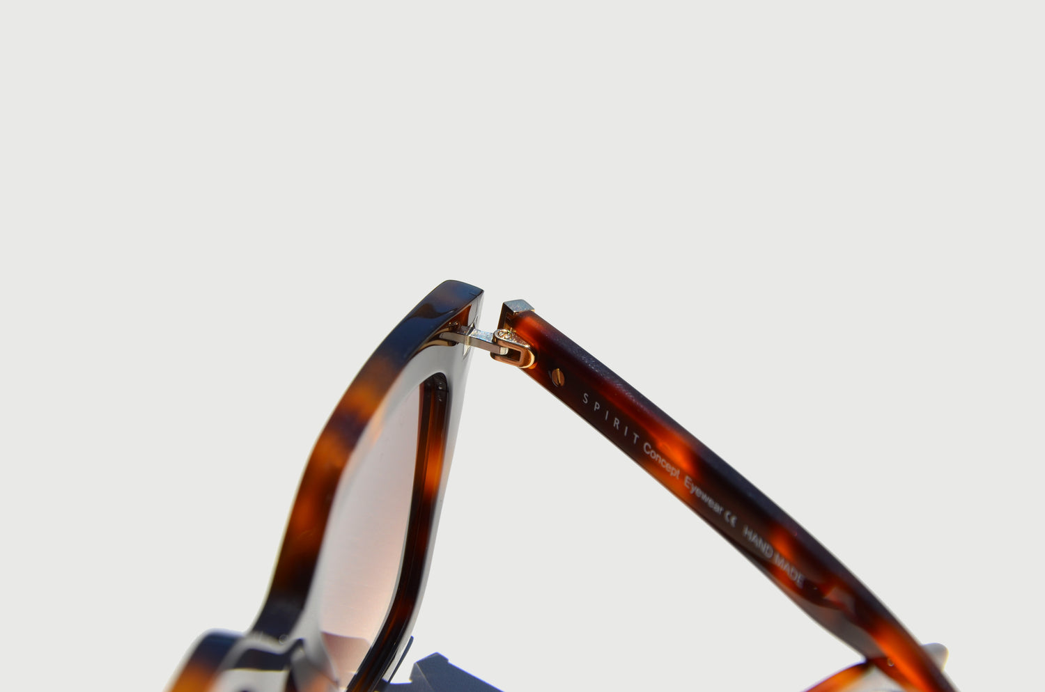 Close-up of brown sunglasses hinge