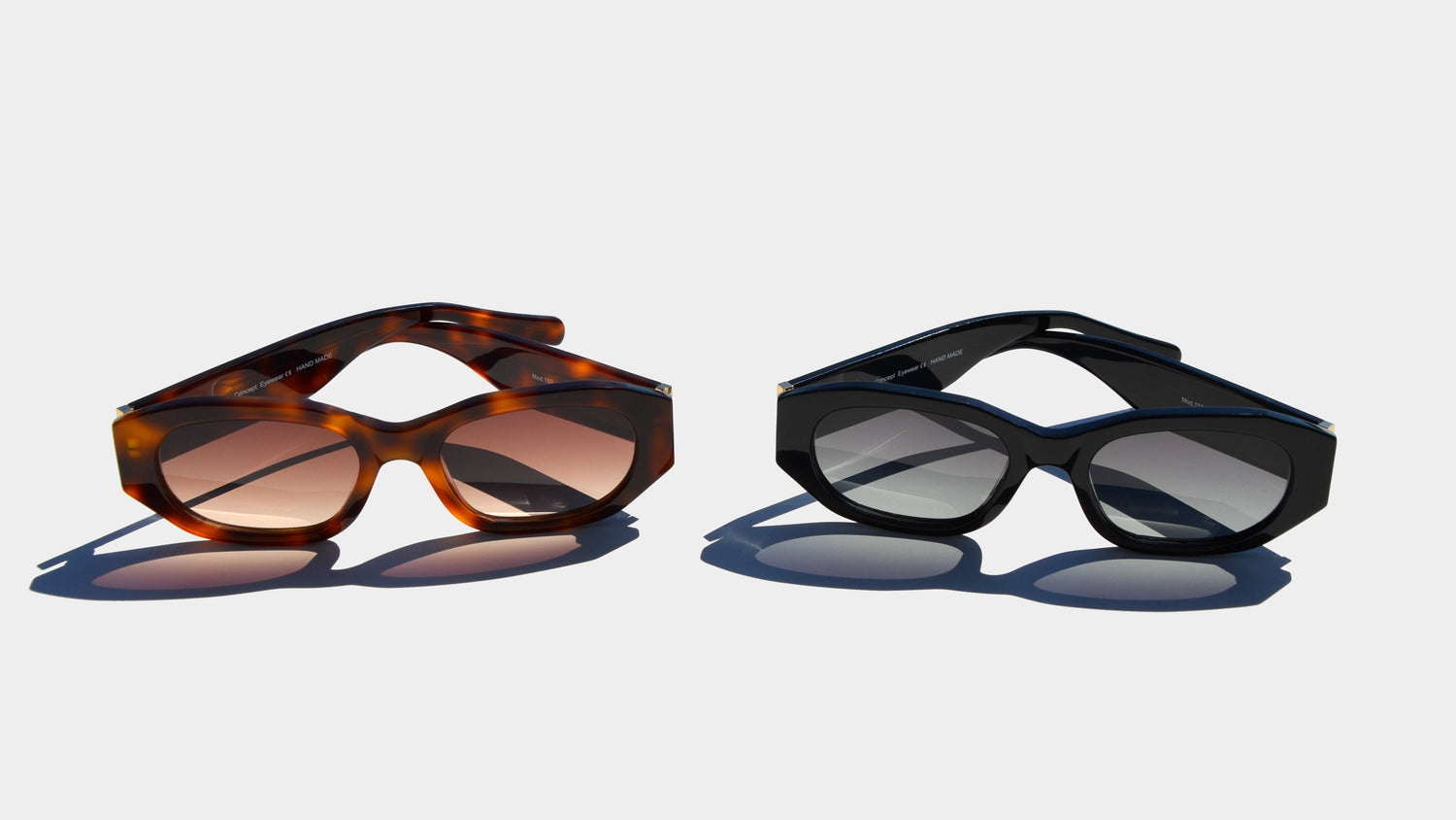 A product image featuring two pairs of rectangle shaped eyewear against a light backdrop. The eyewear on the left showcases a Havana brown frame with warm amber-tinted lenses, while the one on the right has a sleek black frame with gradient gray lenses.