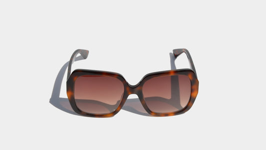 Front view of Bailey Havana brown butterfly eyewear with elegant amber lenses and a chic oversized frame design.