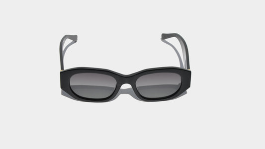 Front view of shiny black Dakota sunglasses with bold rectangular frames and sleek gradient grey lenses, perfect for a polished look.