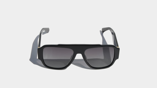 Front view of shiny black Taylor sunglasses with square frames and gradient grey lenses, offering a modern and polished look.